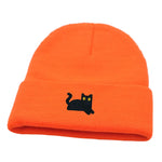 Orange beanie with a black cat embroidery on a white background
