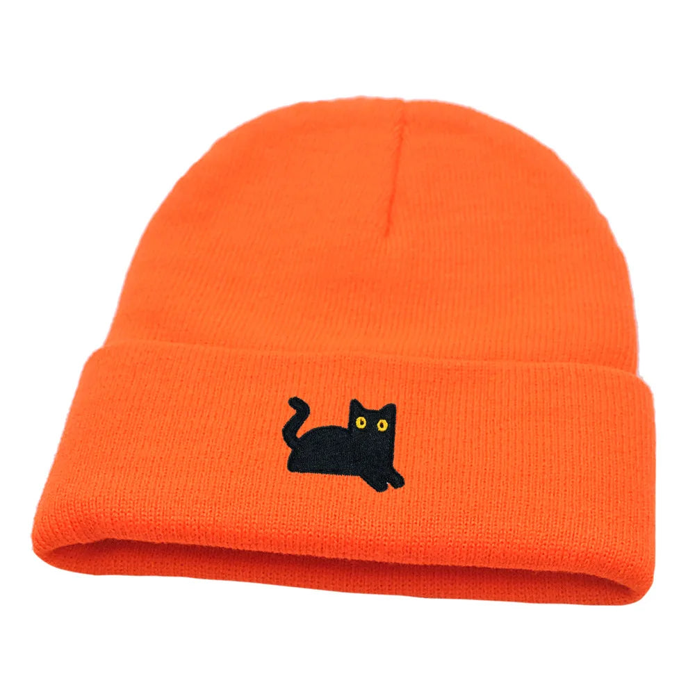 Orange beanie with a black cat embroidery on a white background