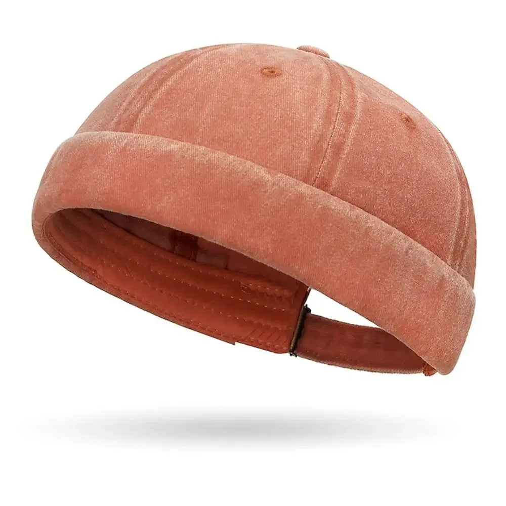 Pinkish-brown cap with a strap on a white background