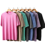 Side view of oversized drop-shoulder graphic tee showing loose fit and length