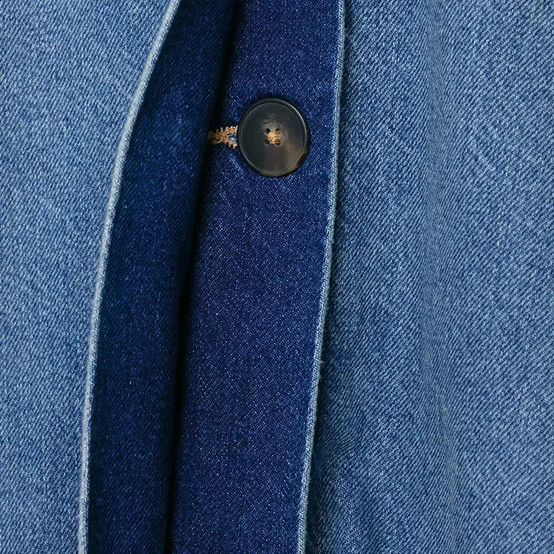 Close-up of ruched detailing on women's oversized vintage wash denim-effect jacket