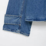 Women's oversized vintage wash denim jacket styled as a layering piece — full outfit view