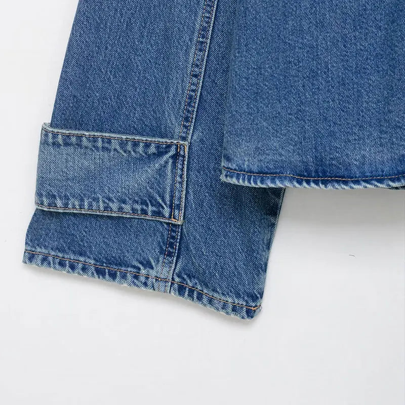 Women's oversized vintage wash denim jacket styled as a layering piece — full outfit view