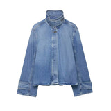 Women's oversized vintage wash denim jacket styled in streetwear look — alternative outfit view
