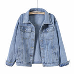 Women's oversized blue denim jacket, back view showing loose silhouette