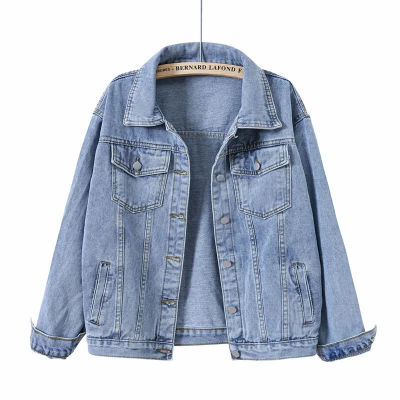 Women's oversized blue denim jacket, back view showing loose silhouette
