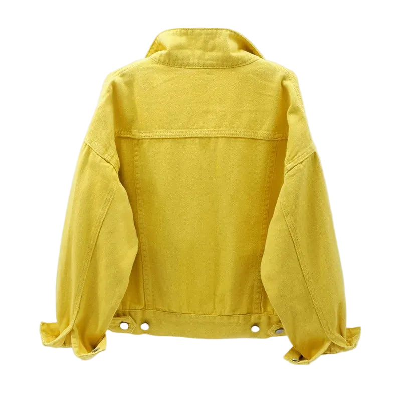 Close-up detail of functional front pocket on women's oversized denim jacket