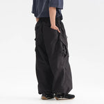 Parachute cargo pants worn, front view