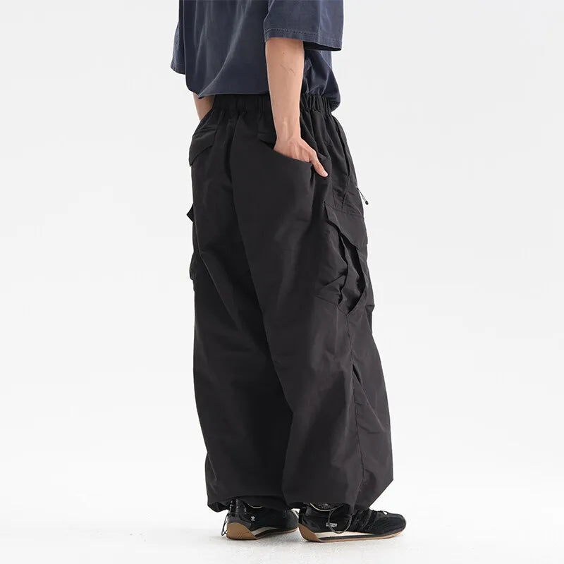 Parachute cargo pants worn, front view