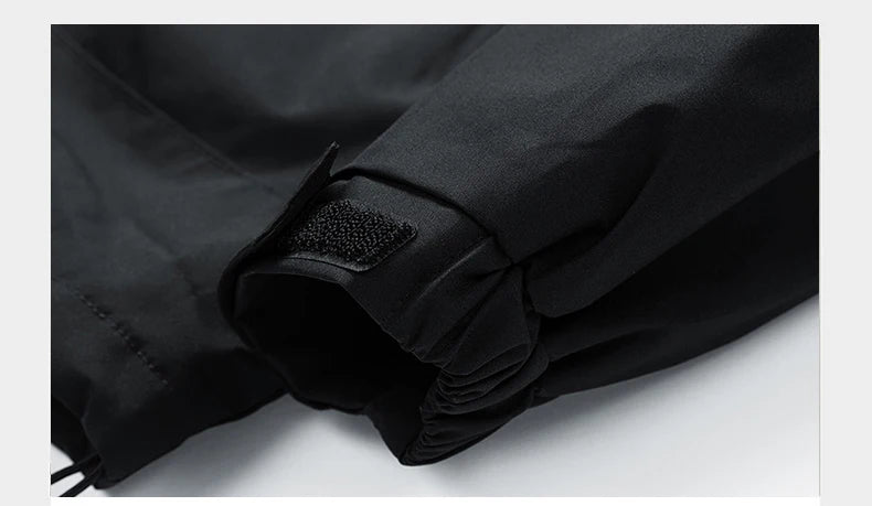 Close-up of a black jacket with a patch on a light gray background