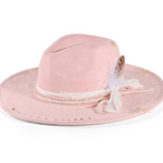 Pink And White Distressed wide-brim cowboy hat worn in lifestyle setting
