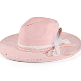 Pink And White Distressed wide-brim cowboy hat worn in lifestyle setting