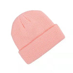 Pink beanie hat on a white background
