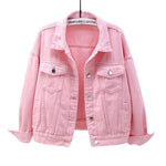 Pink Model wearing women's oversized blue denim jacket, full-length on-figure view