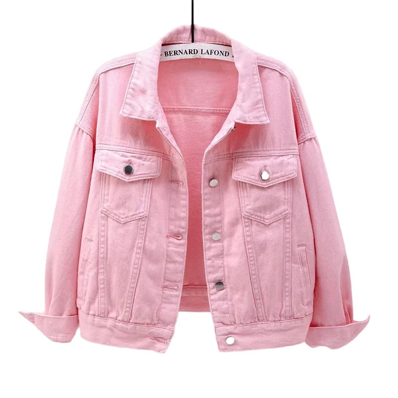 Pink Model wearing women's oversized blue denim jacket, full-length on-figure view