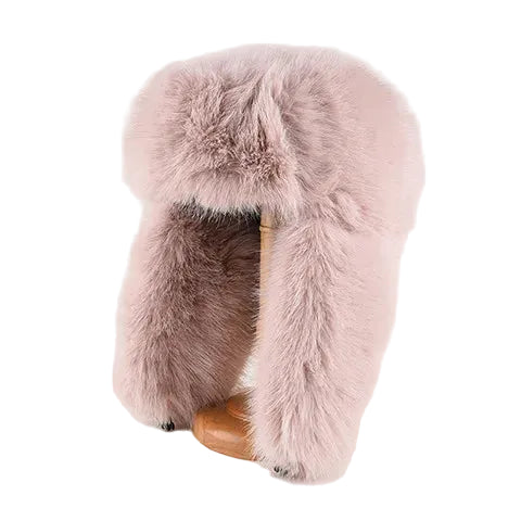 Pink fur hat with a wooden buckle on a white background