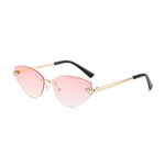 Sunglasses with pink lenses and gold frames on a white background
