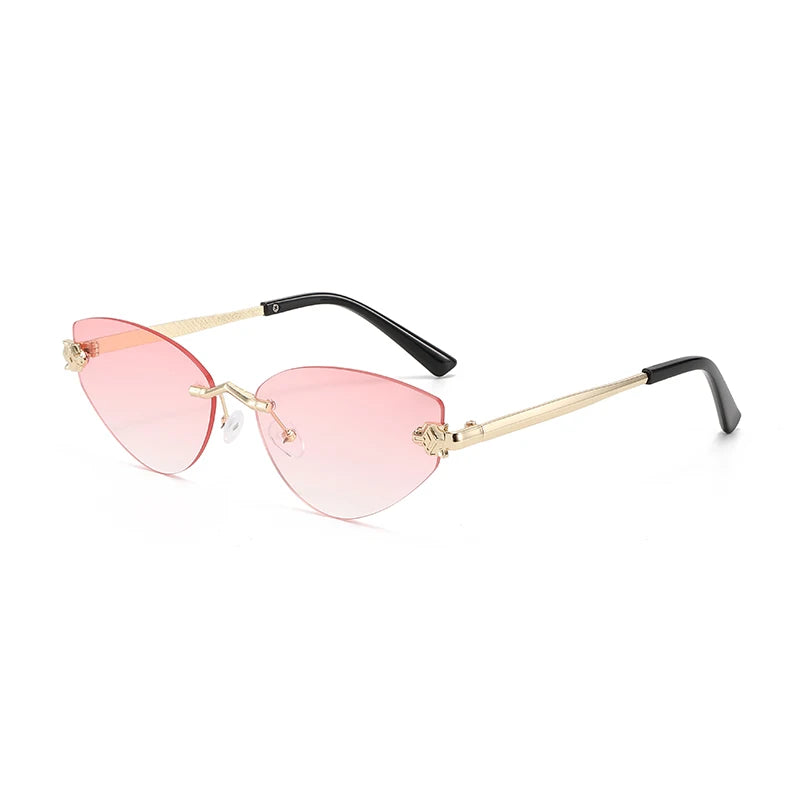 Sunglasses with pink lenses and gold frames on a white background