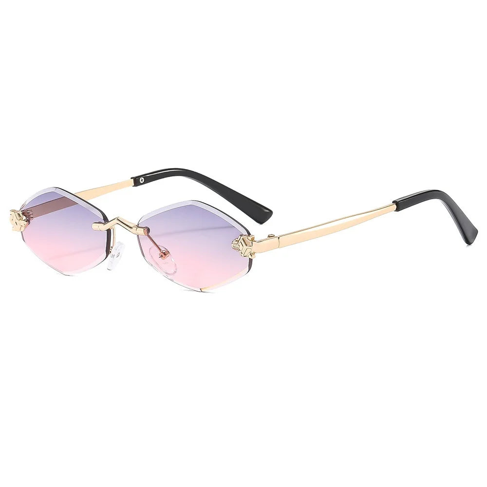 Sunglasses with gold frame and pink gradient lenses on a white background