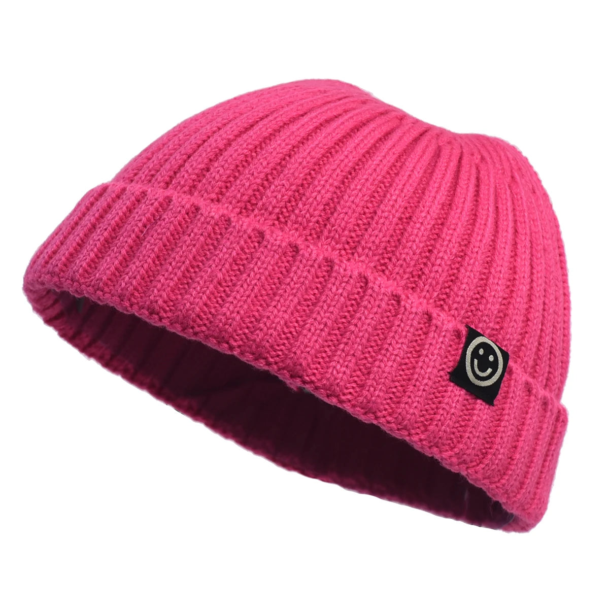 Pink knit beanie with a smiley face logo on a white background