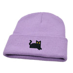 Purple beanie with a black cat embroidered on a white background