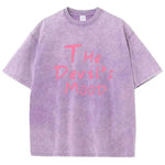 Purple Devil's Mood washed oversized graphic tee — styled streetwear look