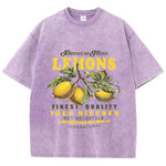 Purple lemon graphic tee worn by model, styled loose with casual outfit