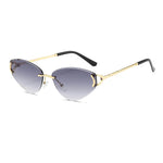 Sunglasses with gold frame and gradient lenses on a white background
