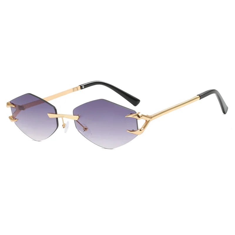 Gold-framed sunglasses with gradient lenses on a white background