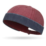Navy blue beanie with a palm tree logo on a white background