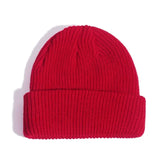 Red knit beanie on a white background