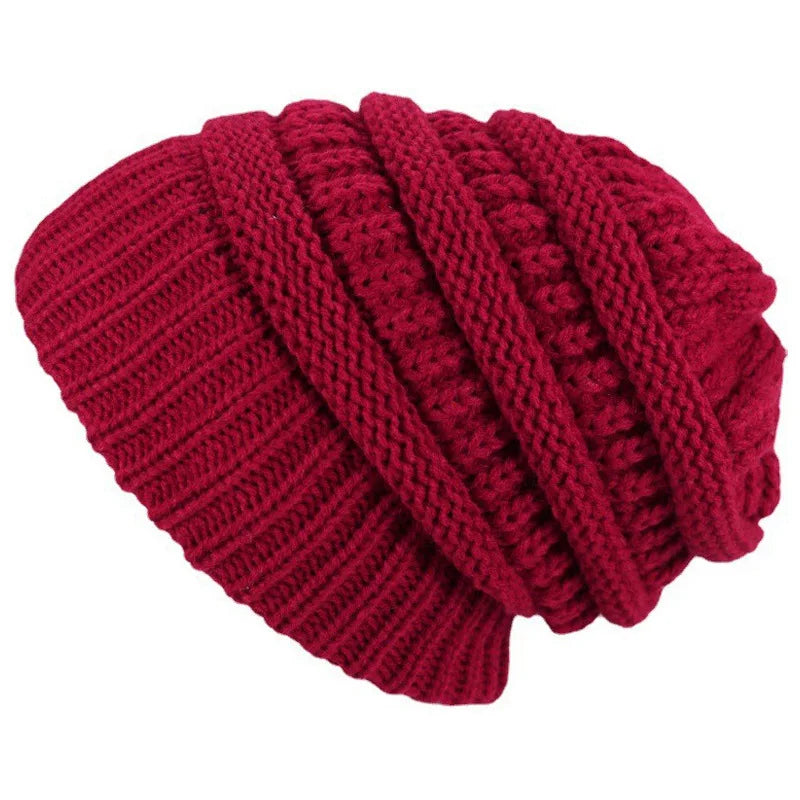 Red knitted beanie on a white background