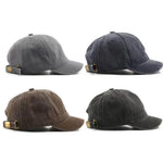 Four different gray baseball caps on a white background