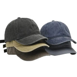 Three baseball caps in gray, blue, and beige on a white background