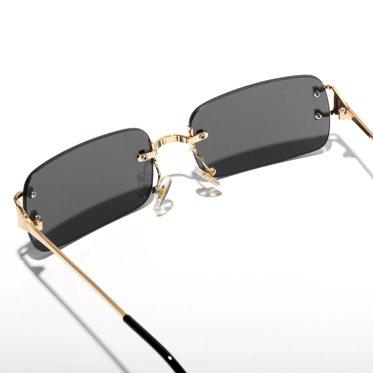Rimless rectangle sunglasses on model, side