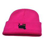 Pink beanie with a black cat design on a white background