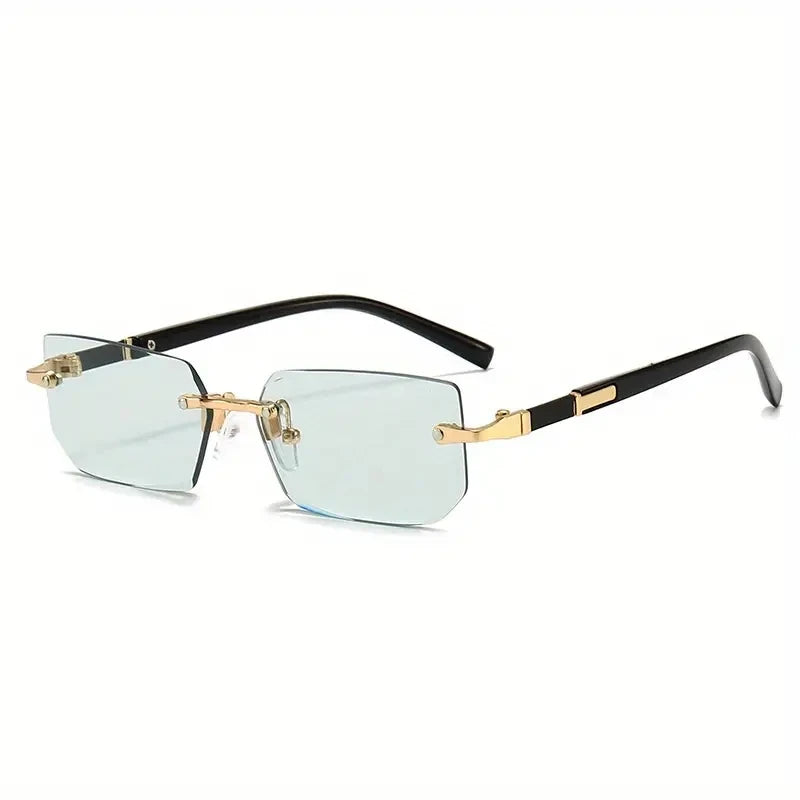 Sunglasses with gold frames and clear lenses on a white background