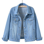 Shallow  Blue Close-up fabric detail of women's oversized denim jacket showing cotton denim texture
