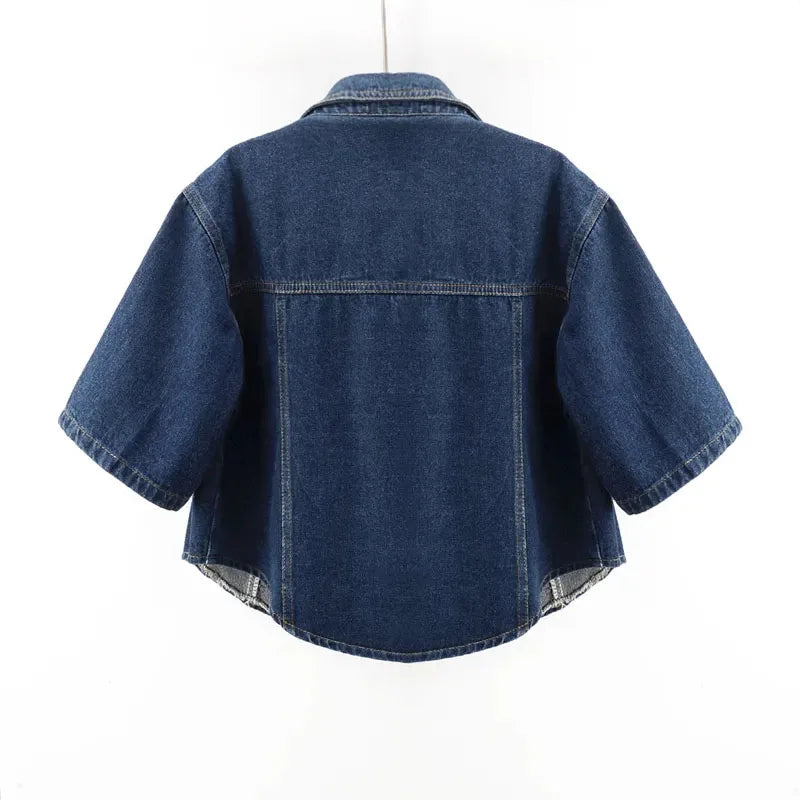 Women's short sleeve cropped denim jacket, back view