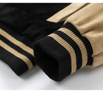 Close-up of black and beige striped sleeves on a white background