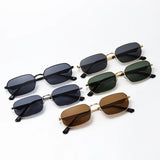Set of sunglasses with different lens colors on a white background