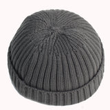 Gray knit beanie on a white background