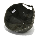 Black cap with white text on a white background