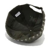 Black cap with white text on a white background
