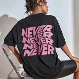 Wavy letter print oversized graphic tee — worn front view