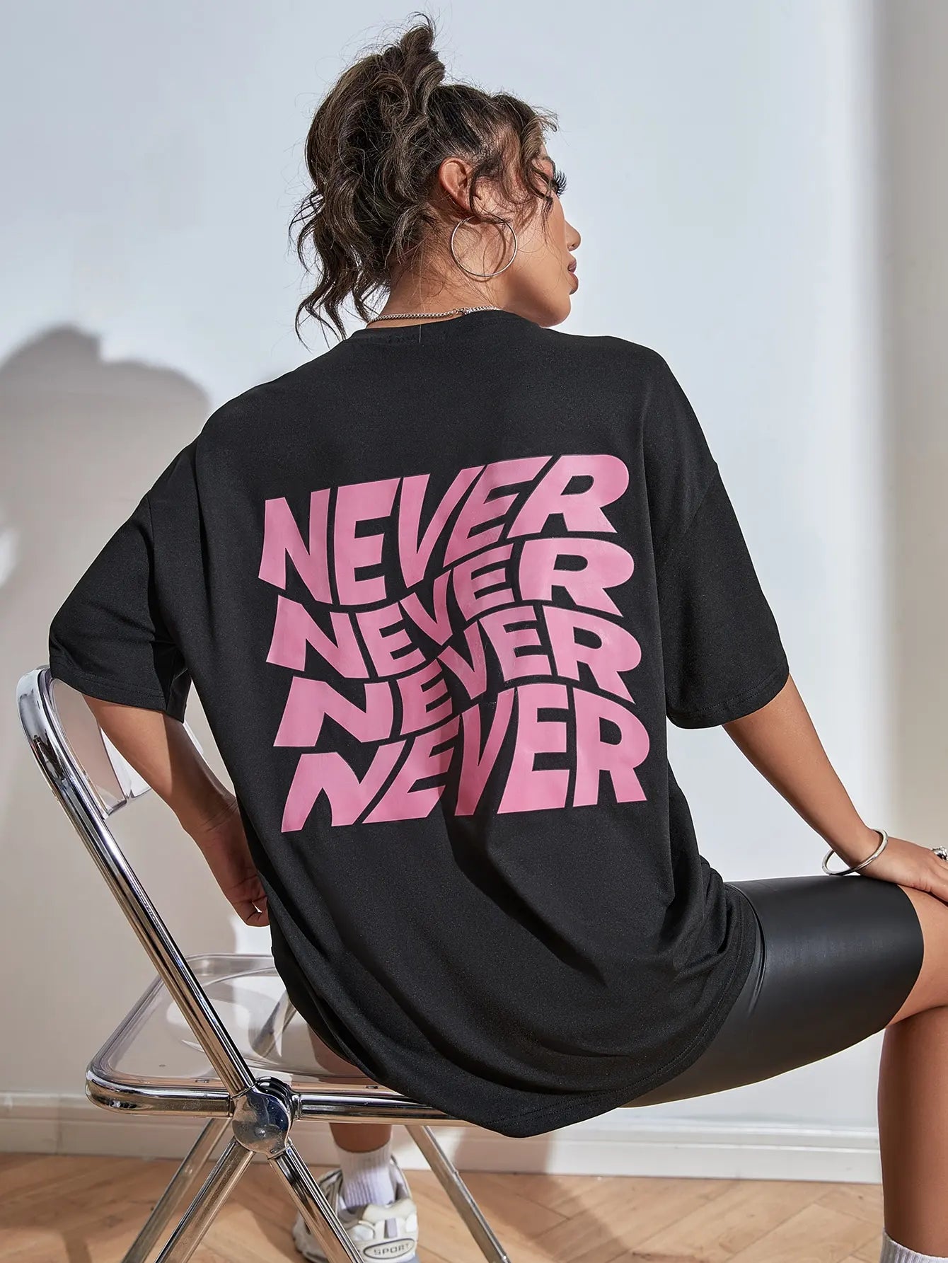 Wavy letter print oversized graphic tee — worn front view