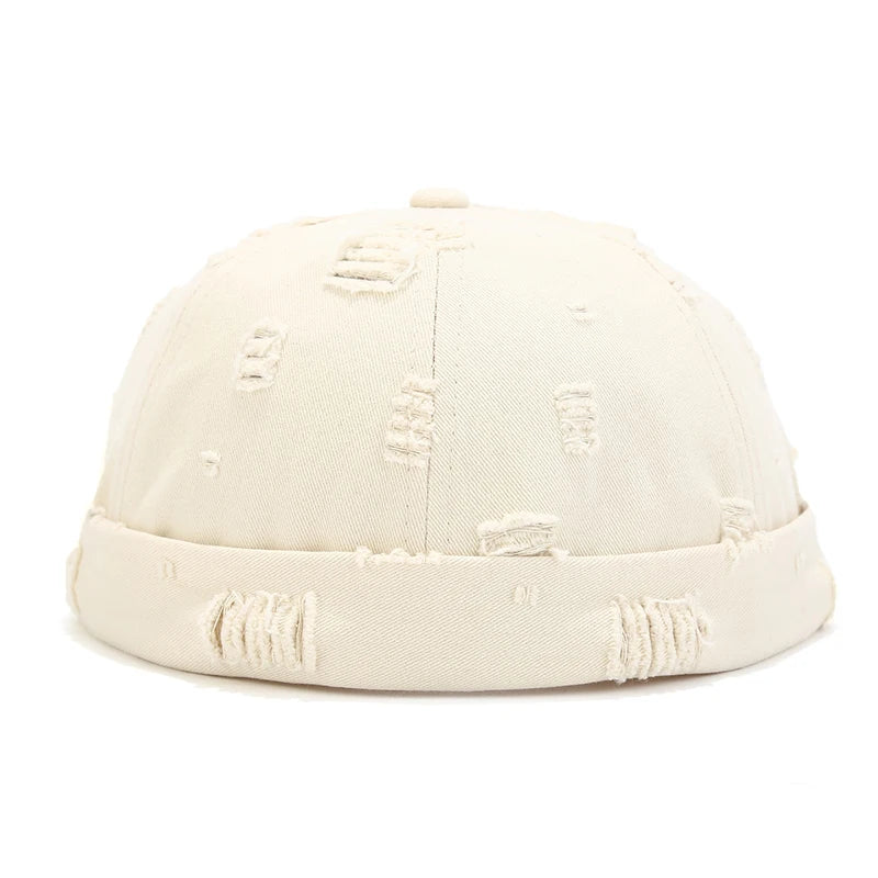 White Model wearing cotton docker cap, three-quarter view