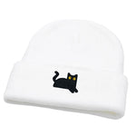 White beanie with a black cat design on a white background