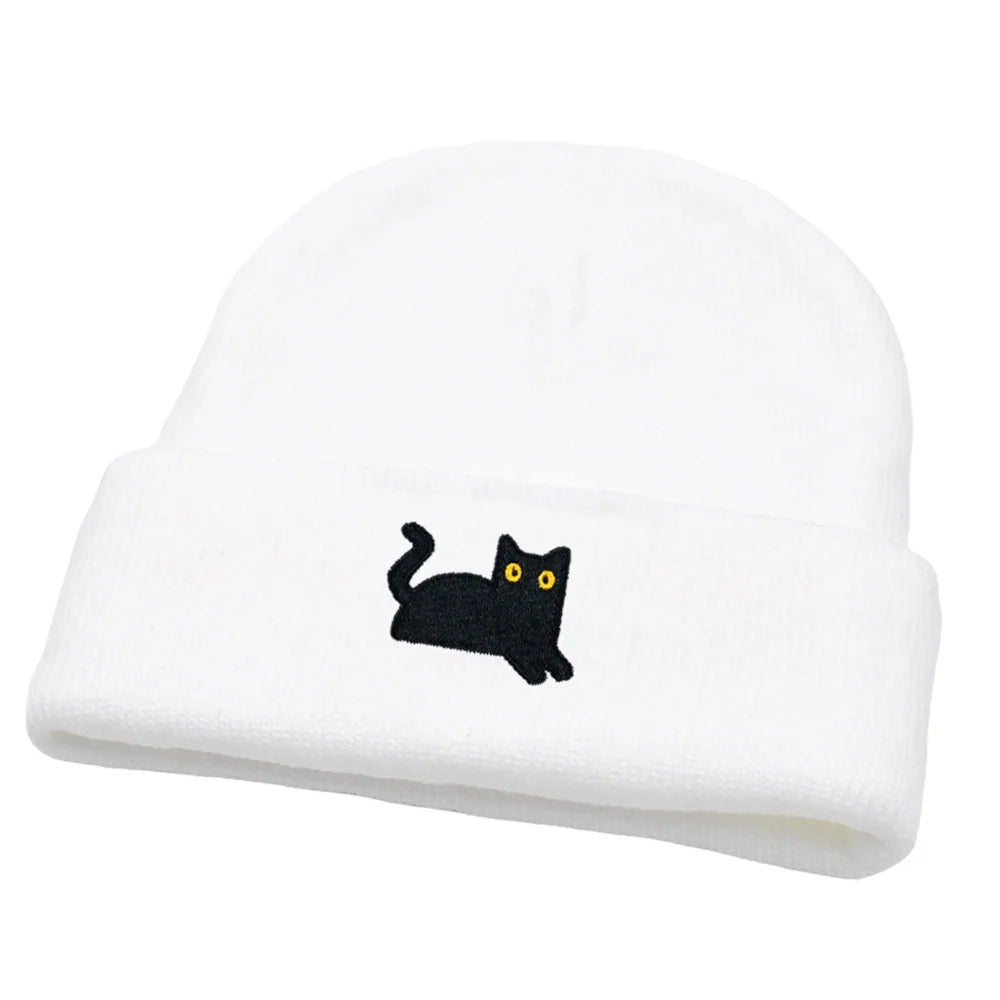 White beanie with a black cat design on a white background
