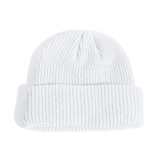 White knit beanie on a white background
